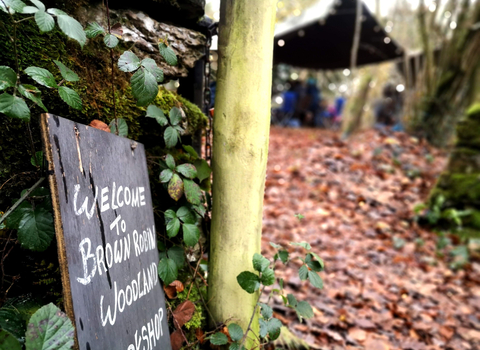 A sign saying 'Welcome to Brown Robin Woodland Workshop'