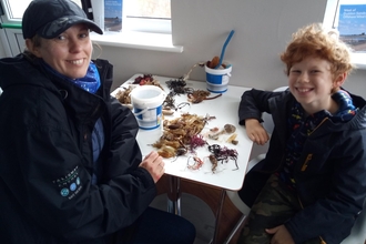 Mum and child with eggcase finds