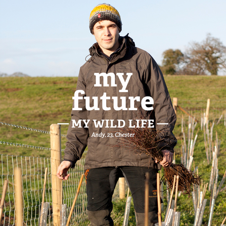 Andy stands by newly planted trees